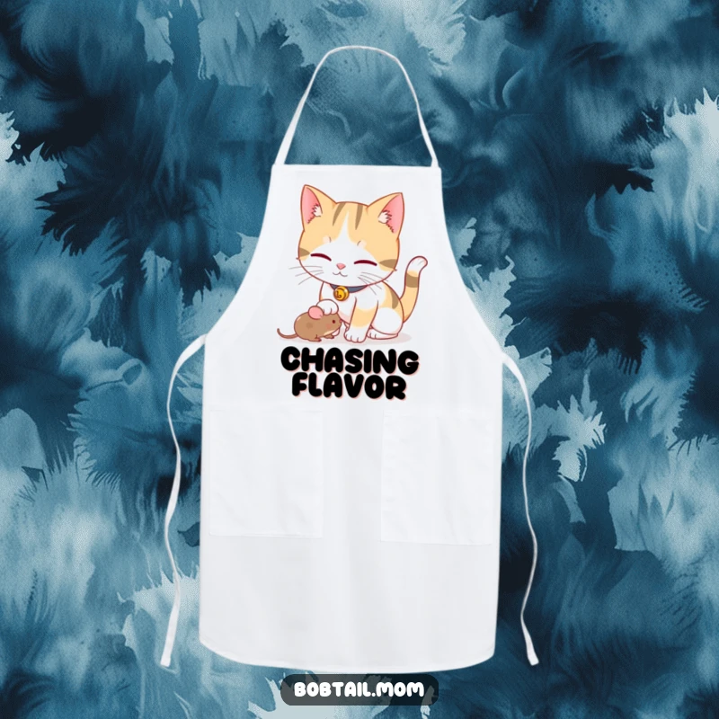 Funny Bobtail cat with a bell collar playfully nudging a toy mouse, featured on a practical, stylish apron.