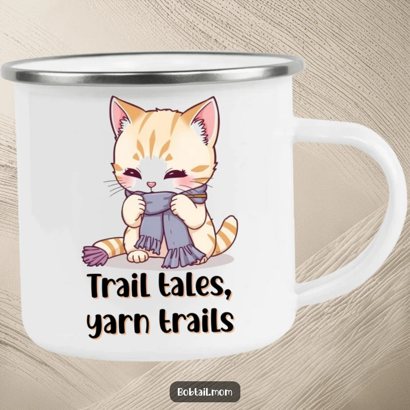 Funny Bobtail cat intently knitting a scarf in an outdoor setting. A humorous camping mug for crafters and adventurers, a great gift.