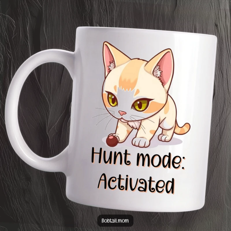 Funny Bobtail Cat Mug featuring a determined Bobtail cat stalking unseen prey with intense focus and playful stealth.