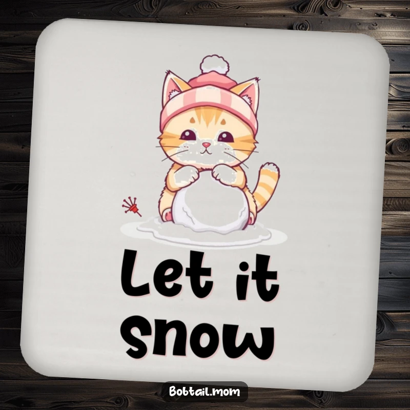 Funny drink coaster with a bobtail cat wearing a winter hat, building a tiny snowball, adding a winter flair.
