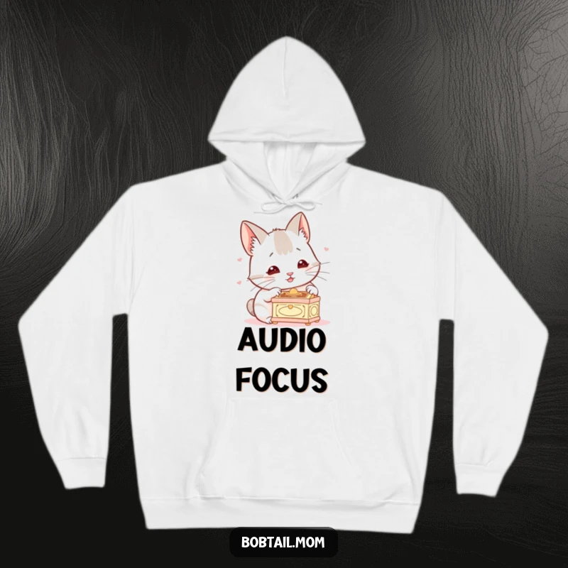 Funny Bobtail Hoodie, depicting a dog with alert ears, listening to a small music box, emphasizing coziness and humor for dog enthusiasts.