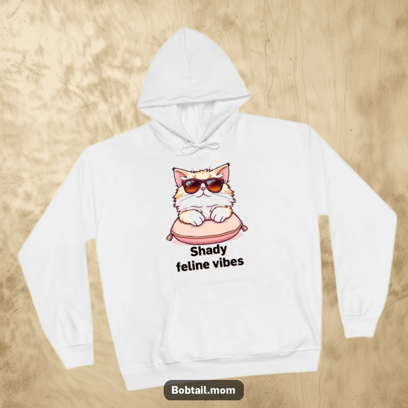 Funny Bobtail cat hoodie featuring a fluffy cat in oversized sunglasses lounging comfortably on a tiny cushion.