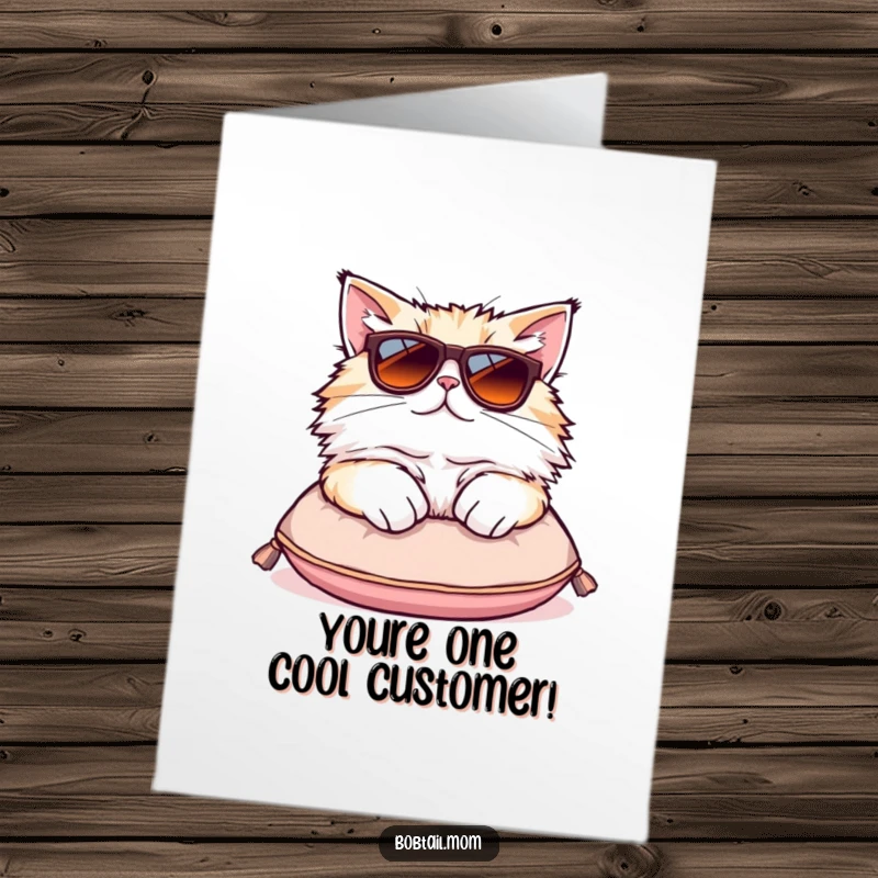 Funny Free Printable Congratulations Card: Fluffy Bobtail cat wearing oversized sunglasses lounging on a tiny cushion, exuding cool.