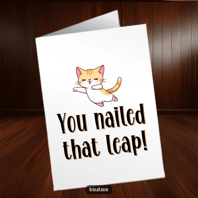 Funny Free Printable Congratulations Card: Bobtail cat in ballet slippers, attempting an elegant leap, celebrating accomplishments with flair, print at home.