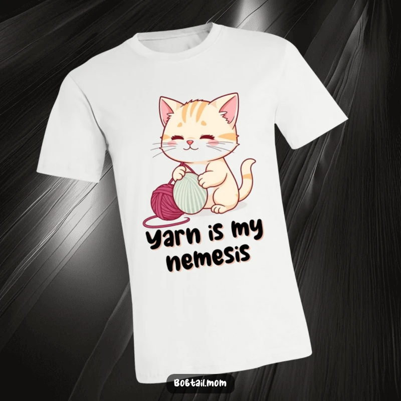 Funny bobtail cat gleefully playing with a large ball of yarn, full of energy and joy, printed on a t-shirt.