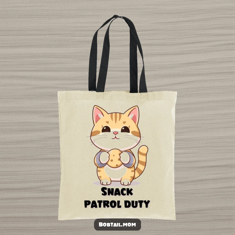 Funny Bobtail cat in oven mitts, presenting a small cookie, perfect for carrying baked goods with humorous flair.